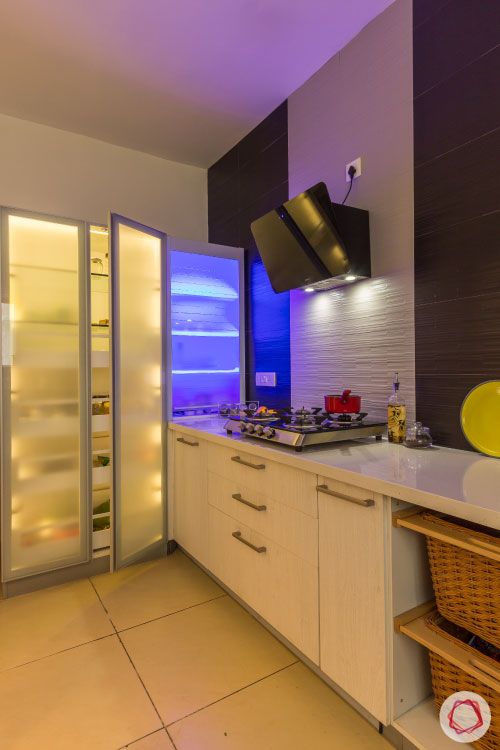 small kitchen design-frosted glass cabinets-light inside cabinets-tall unit