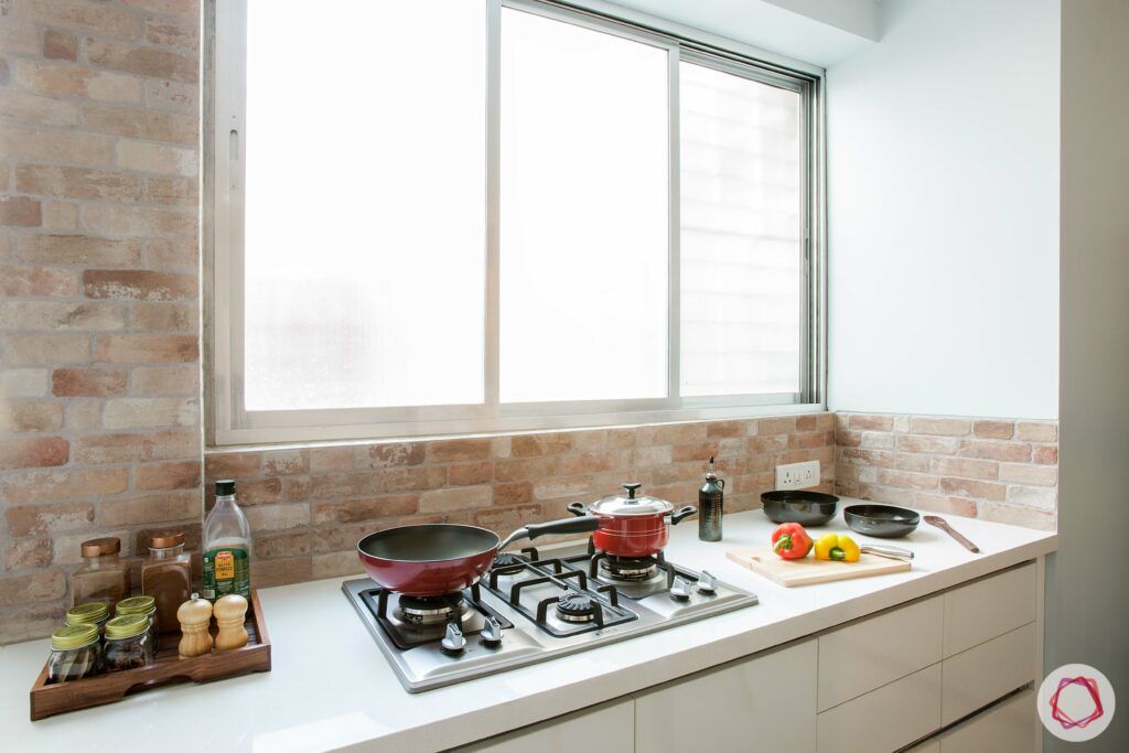 scandinavian interior design-white countertop-exposed brick wall