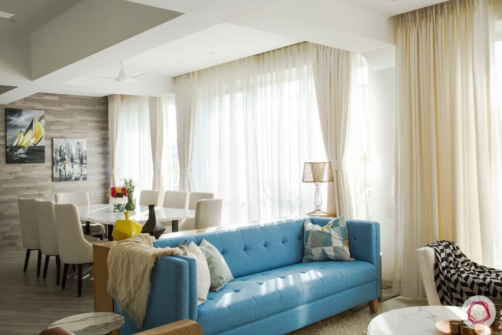 scandinavian interior design-blue sofa-white dining table