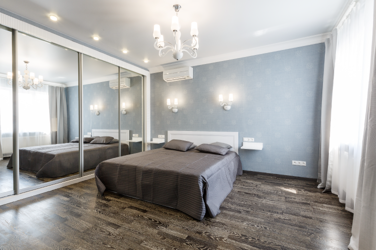 natural lighting at home-grey walls-chandelier-grey bed designs