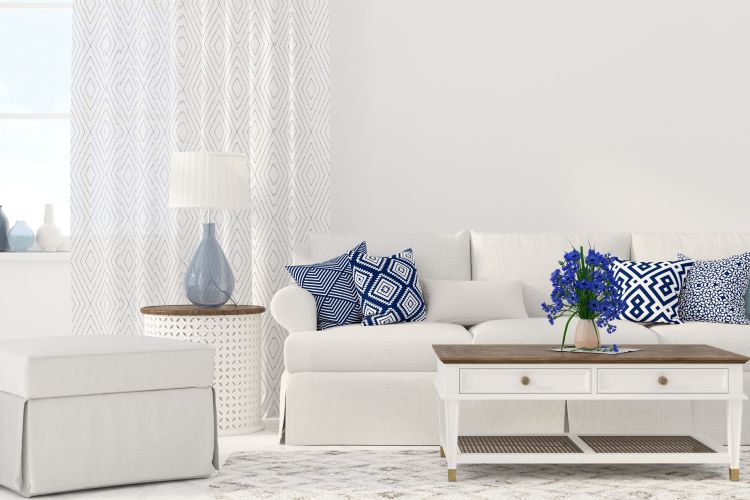 minimalist vs scandinavian design-white sofa designs-blue cushions-white coffee table designs
