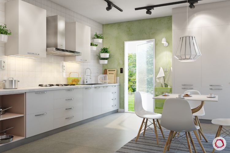 open kitchen design-white chairs-green wall-white cabinets-pendant light