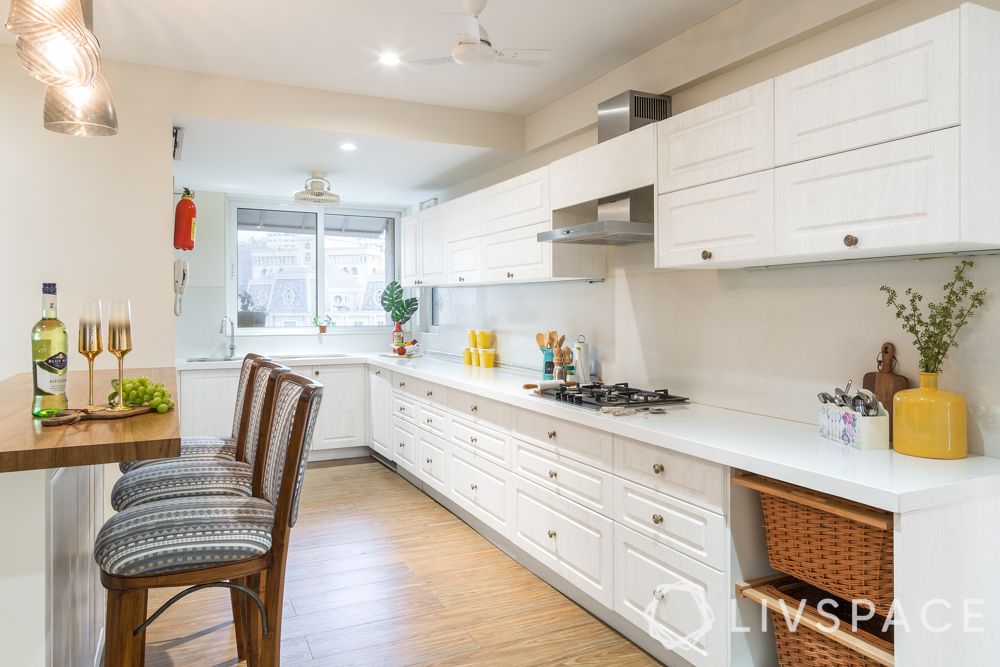 maintain white kitchens-hob-chimney-wooden backsplash