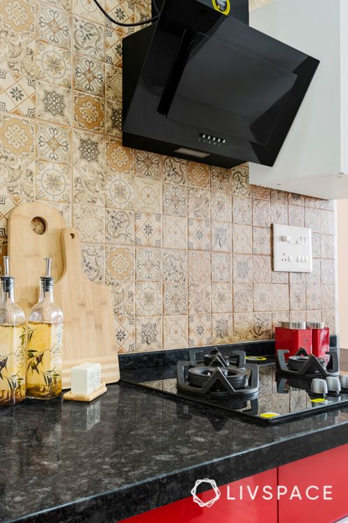 black granite countertop designs-red kitchen cabinets