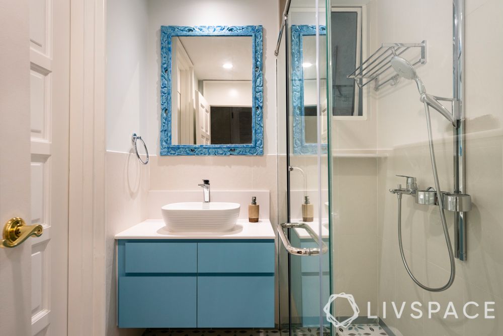 pebble-bay-condo-kids-bathroom-compact-blue-cabinets