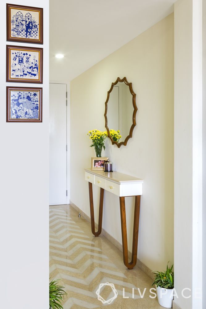   foyer design-mirror-console table-plants-frames