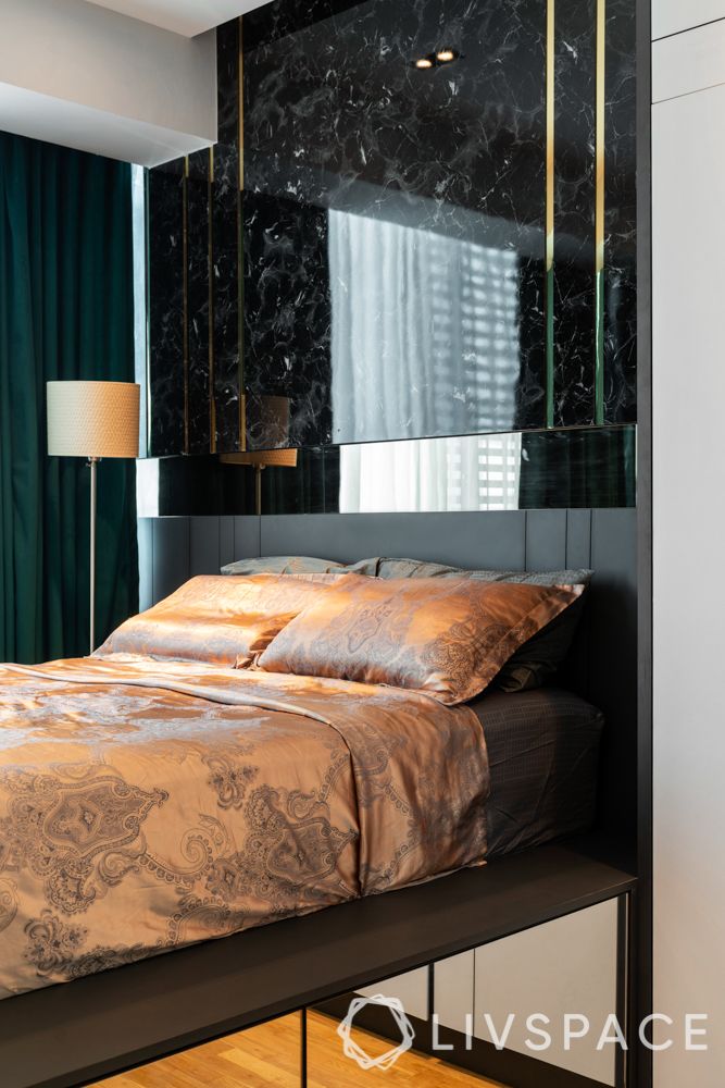 condominium singapore-bedroom design-mirror panelling-floor lamp-wooden flooring-marble finish laminate headboard