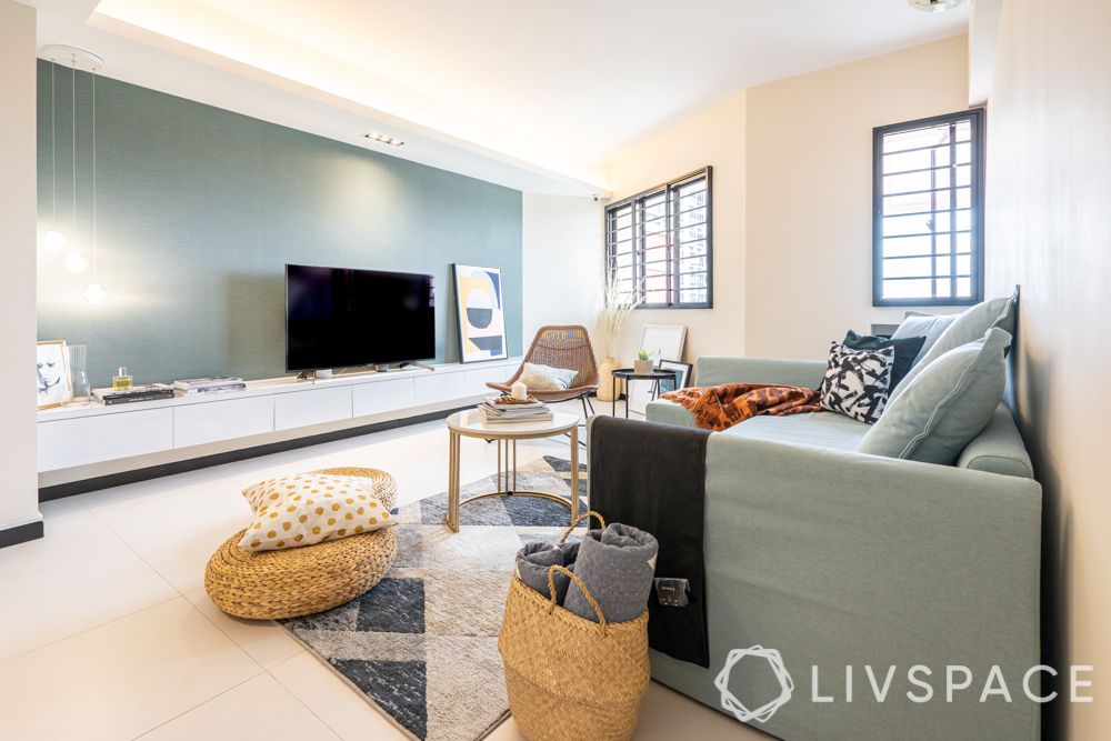 living room-display unit-TV unit-pendant lighting-blue sofa- blue accent wall