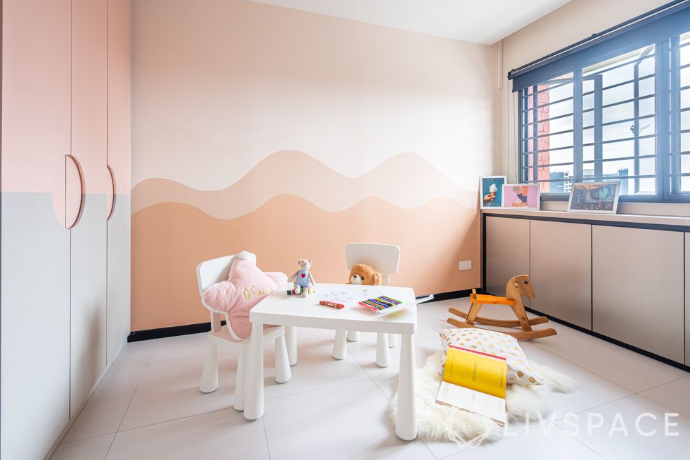 hdb house-kids room-white table-chair-pink painted walls-storage-hinged wardrobe 