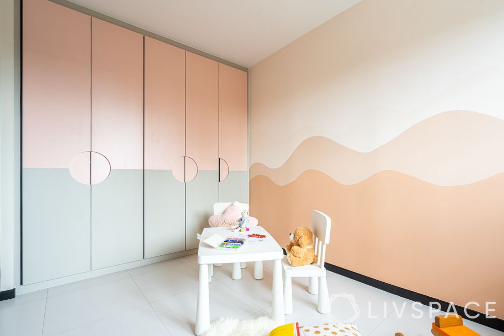 hdb house-kids room-white table-chair-pink painted walls-storage-hinged wardrobe 