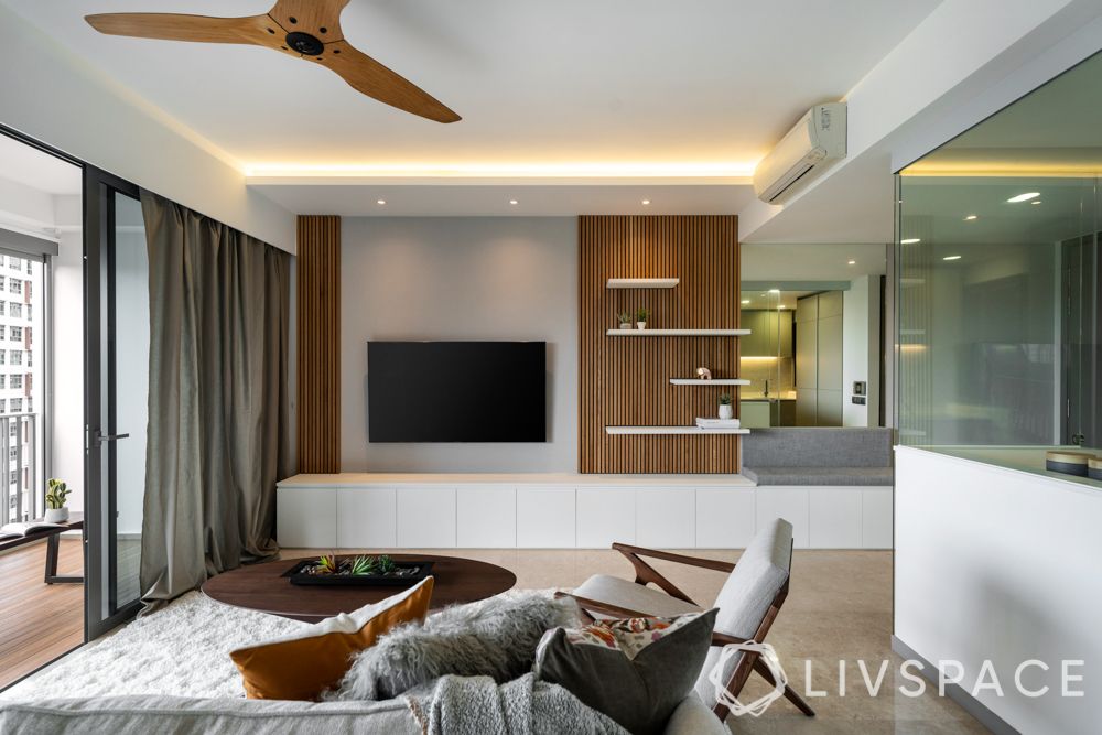 condo design-sofa-armchair-coffee table-rug-feature wall-balcony