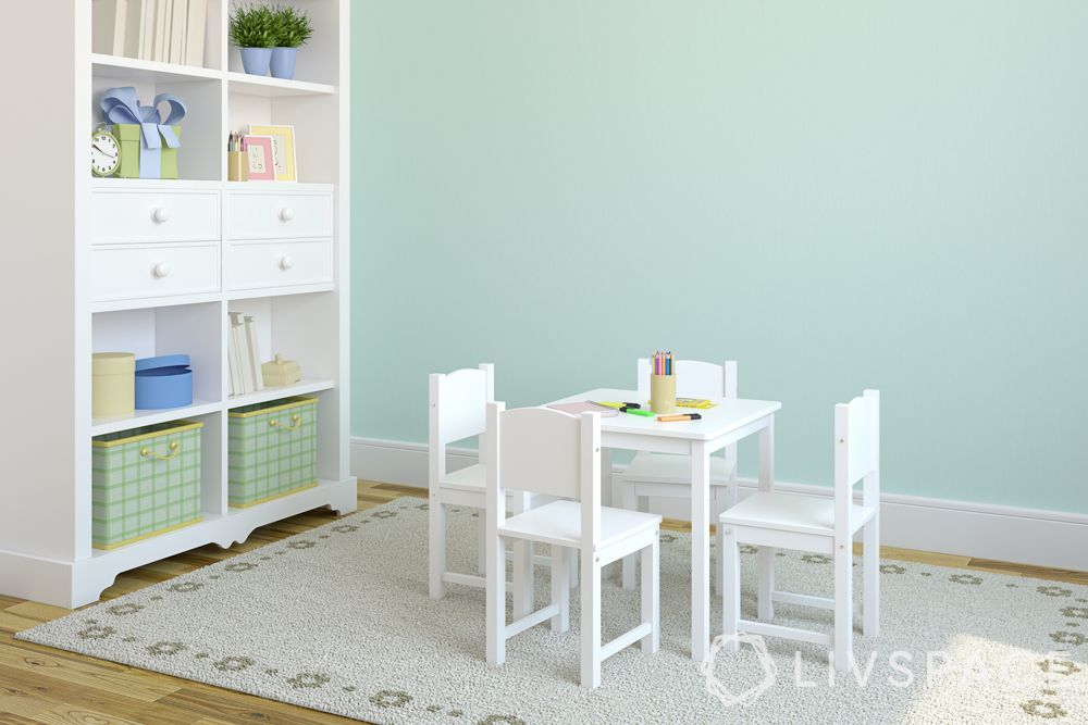 room colour ideas-green wall-white chairs-bookshelf-kids room