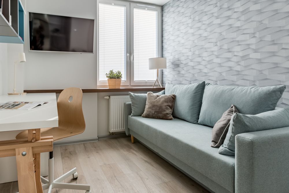 renovation in Singapore-blue sofa-study desk-tv-heater-compact room