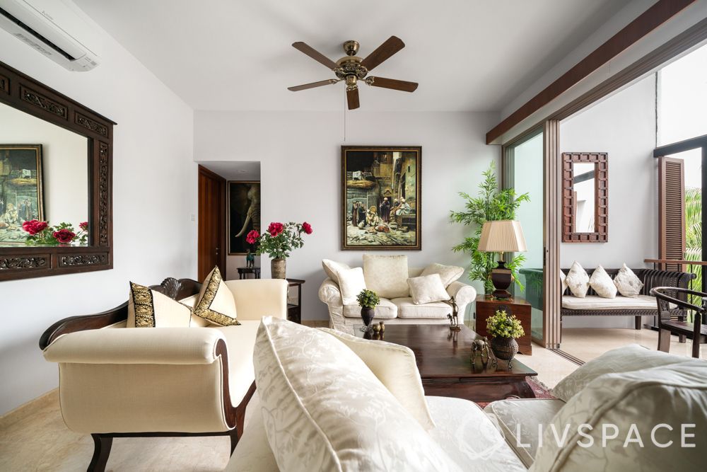 palm grove condo-living room-white walls-paintings