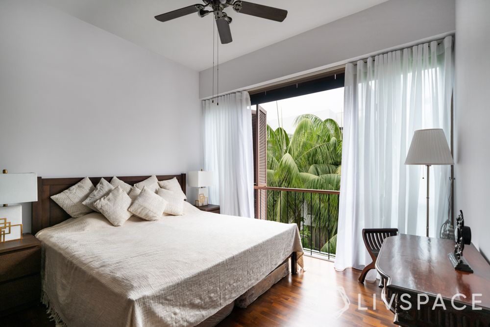 palm grove condo-bedroom-white-walls-parquet flooring