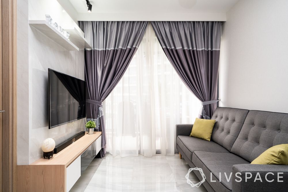 home design-living room-grey curtains-marble finish laminate-grey sofa-track lights