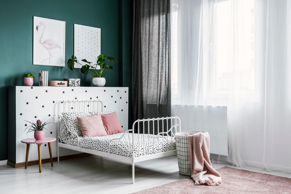 white bed-green wall-pink decor