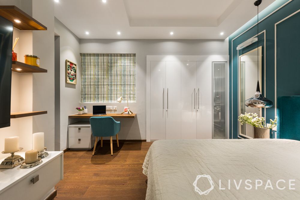 hdb bedroom design with study table-blue chair-wooden study unit-white wardrobes
