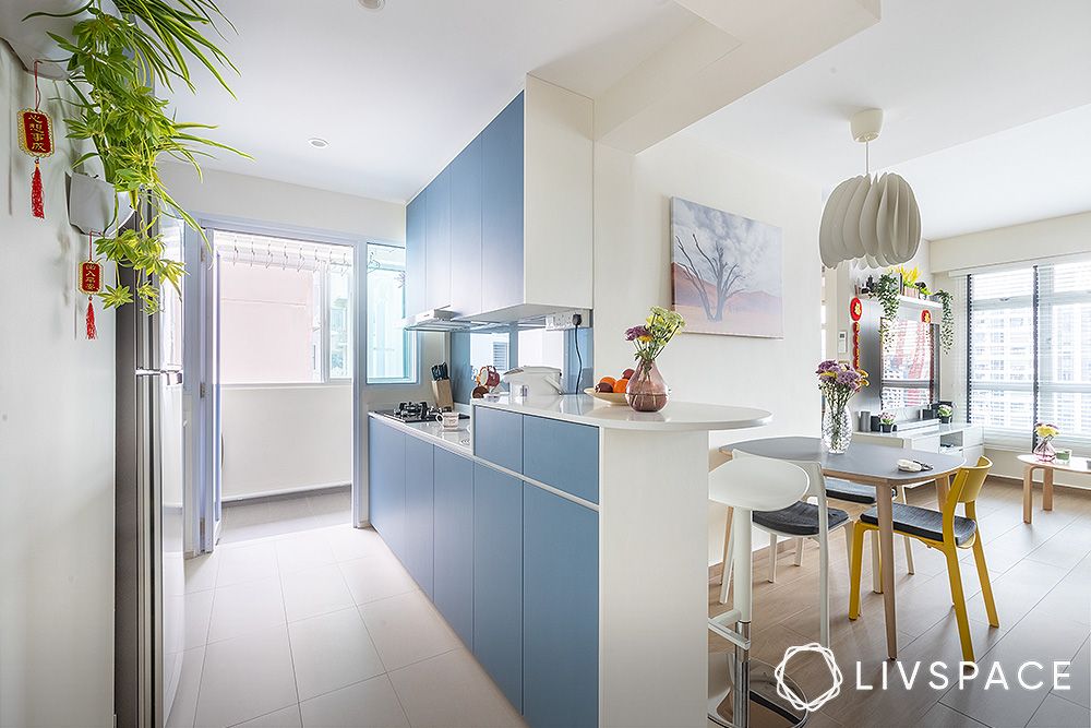 open-galley-kitchen-layout-with-blue-cabinets