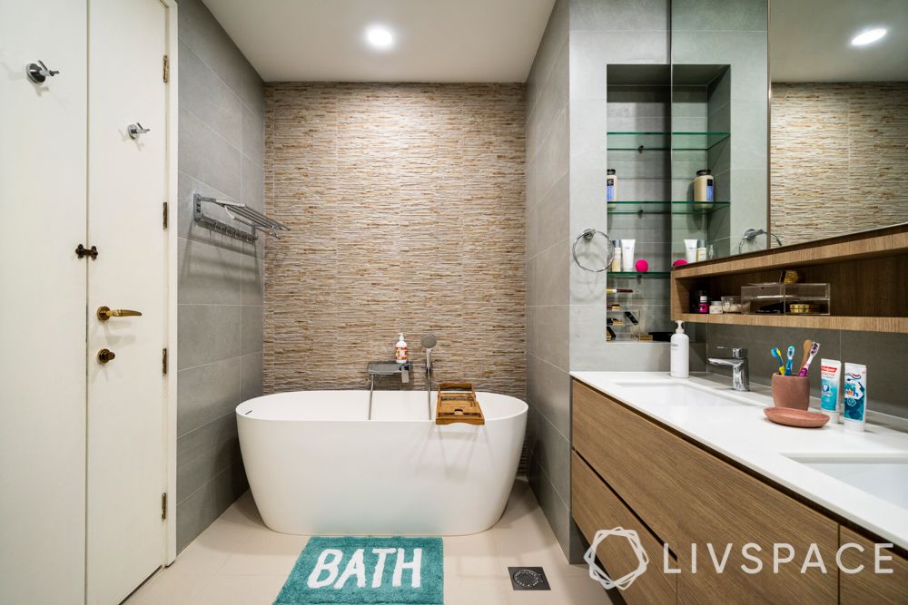 3-room-condo-master-bath-bathtub-stone-wall