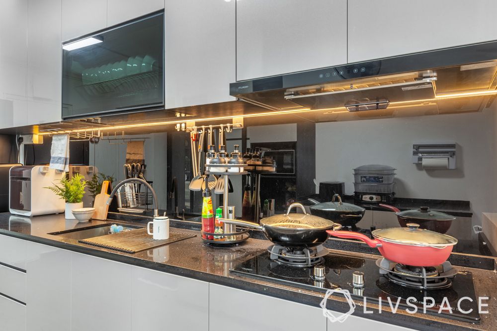 5-room-hdb-renovation-kitchen-hob-unit-black-backsplash