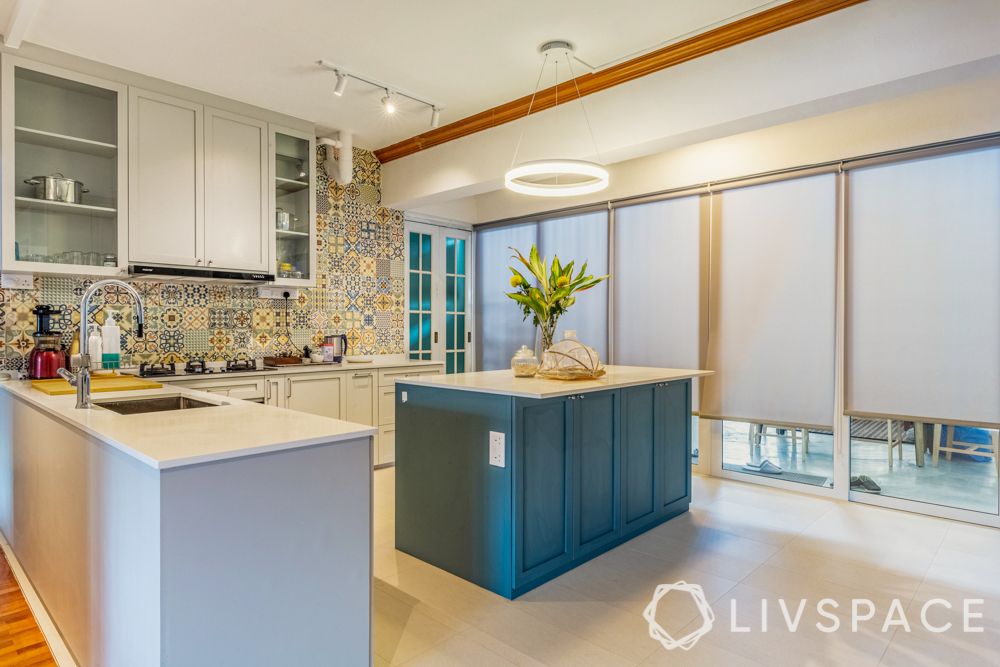 kitchen-with-an-island-scandinavian-white-cabinetry-blue-island