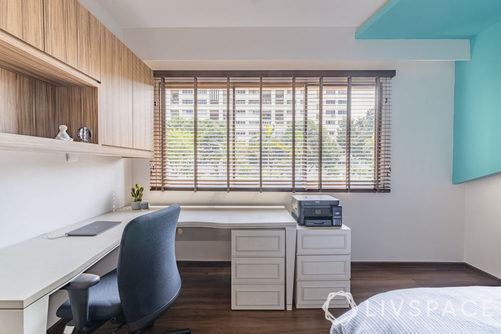 modern-interior-design-son-bedroom-study-table-wooden-wall-cabinets