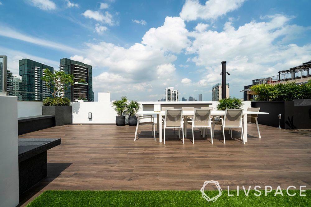 penthouse-condo-rooftop-dining-area-wooden-deck