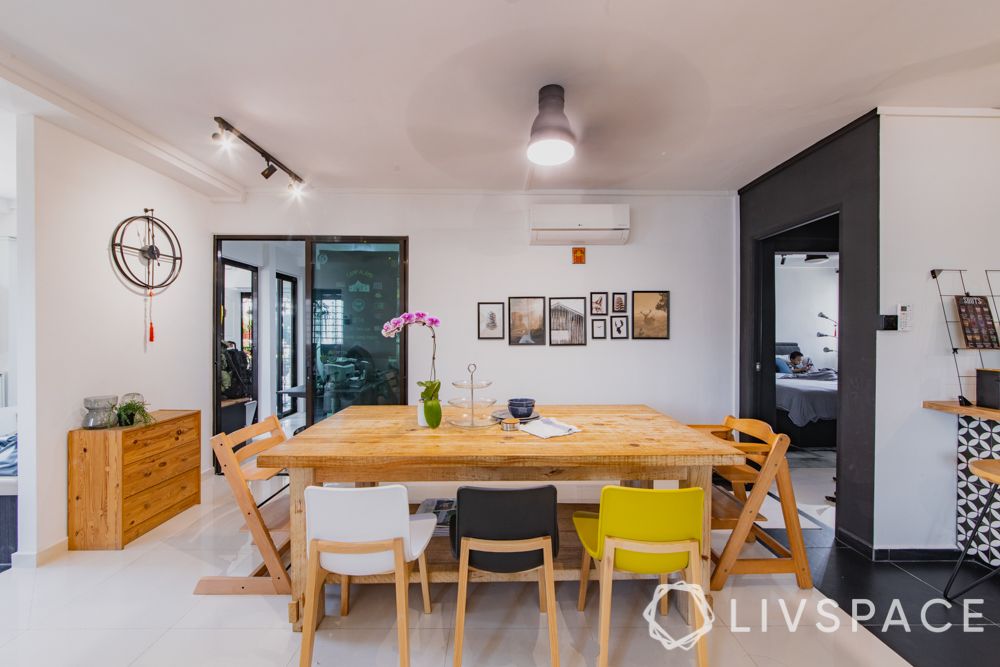 3gen-flats-dining-room-colourful-chairs-wall-frames-crockery-unit