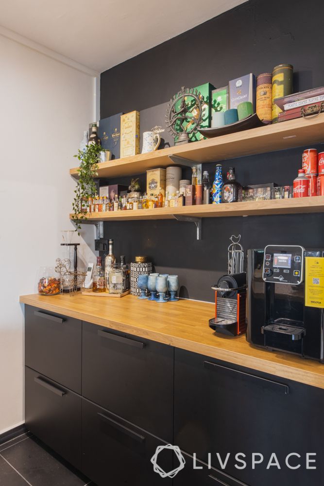 breakfast-counter-black-cabinetry-wall-shelves