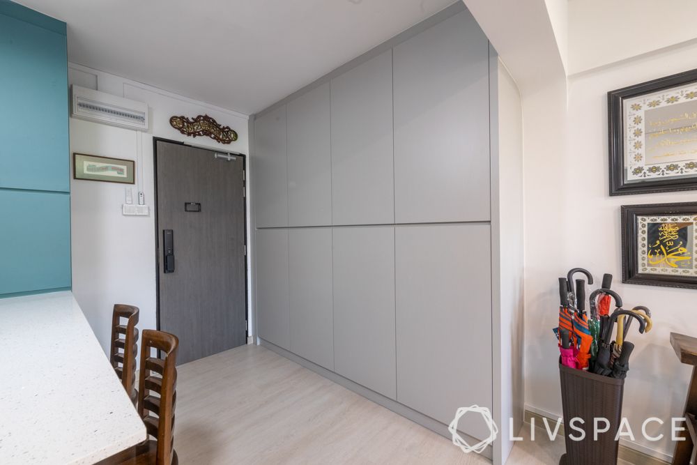 executive-apartment-entryway-grey-cabinets-umbrella-holder