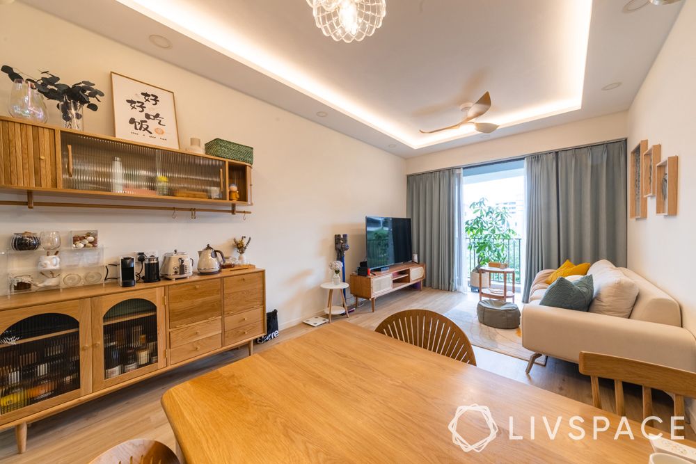 small-condo-design-ideasdining-room-sideboard-light-wood-storage-display-glass-shutters
