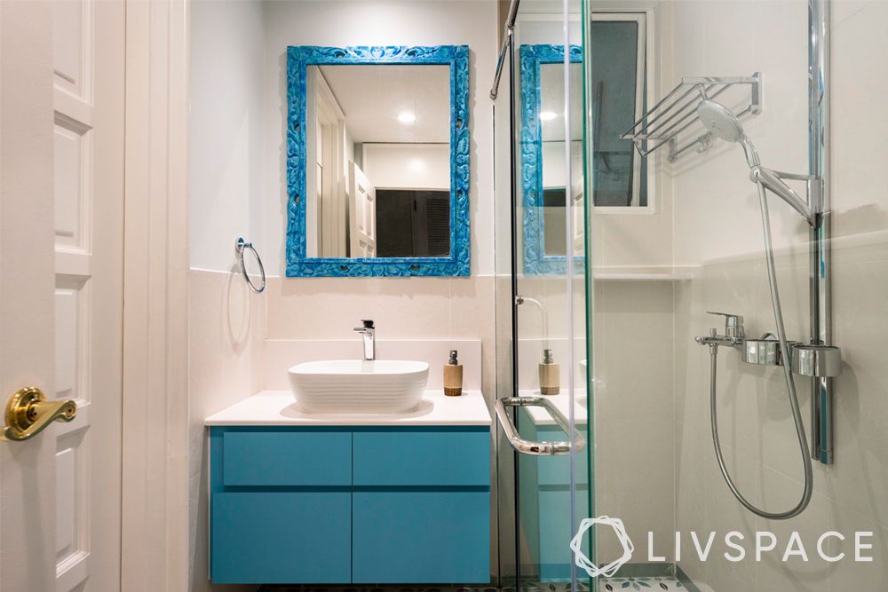 small toilet design–white sink–blue vanity unit