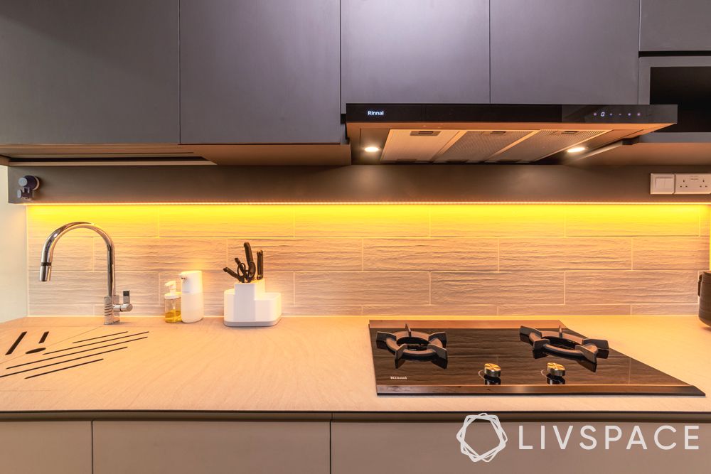 5-room-hdb-design-kitchen-countertop-wooden-grain-backsplash-task-lighting-grey-overhead-cabinets