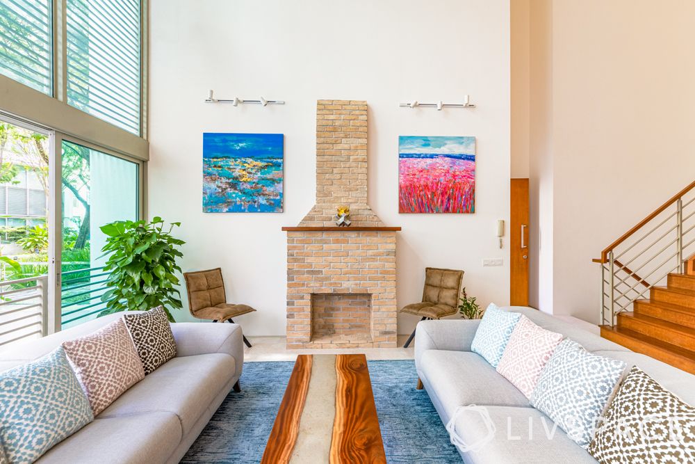 living-room-designer-grey-couch-brown-chimney