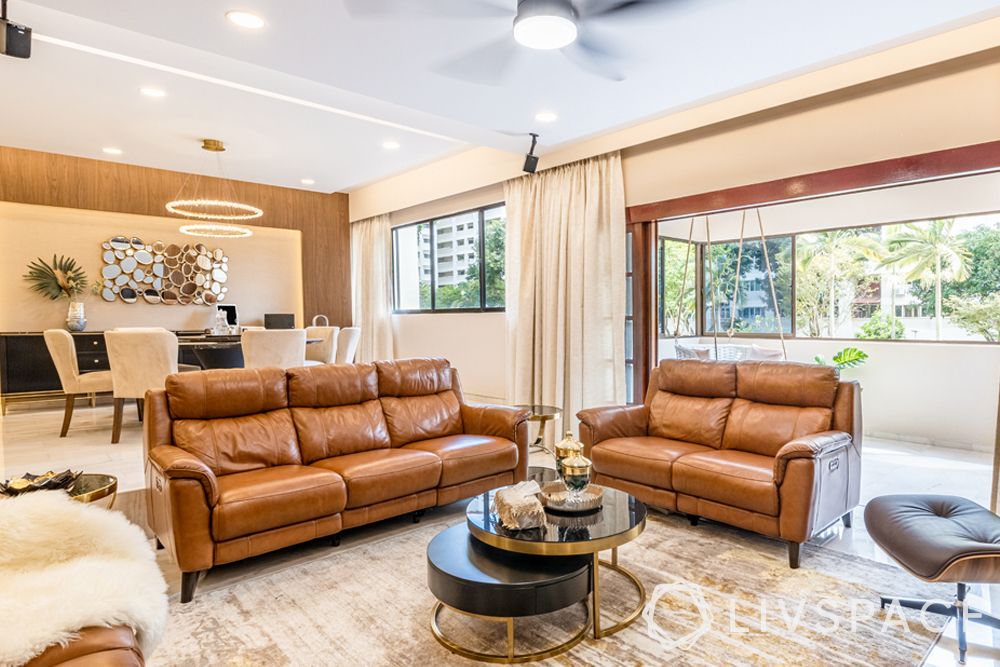 living-room-designer-brown-couches-beige-curtains