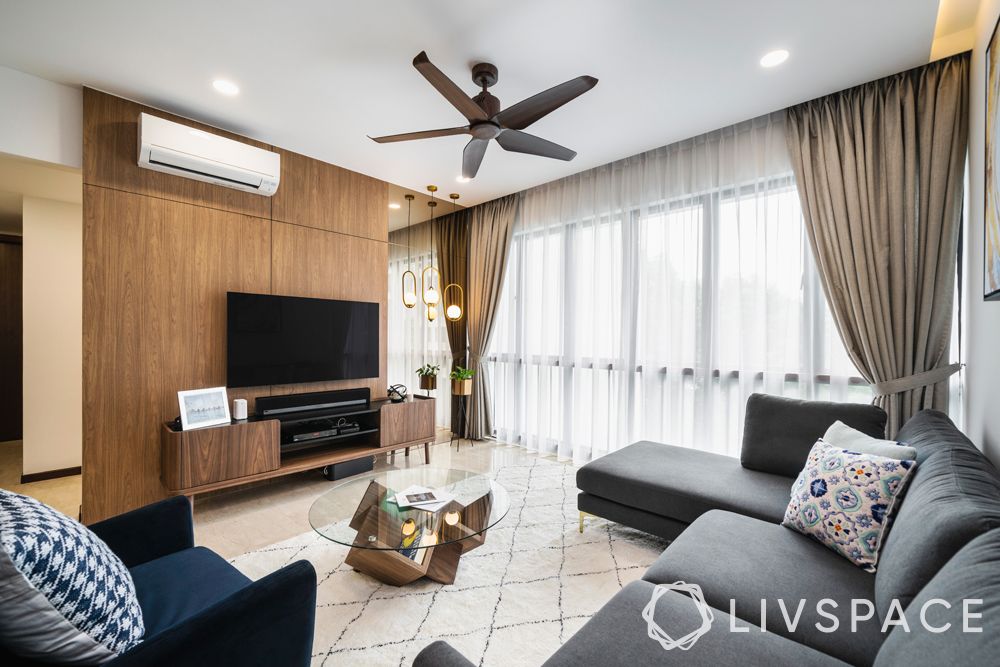 living-room-designer-grey-couch-wooden-television-unit