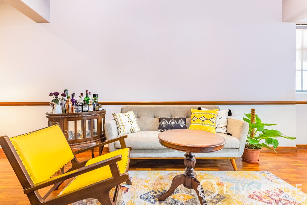 living room designer-wooden flooring-yellow chair