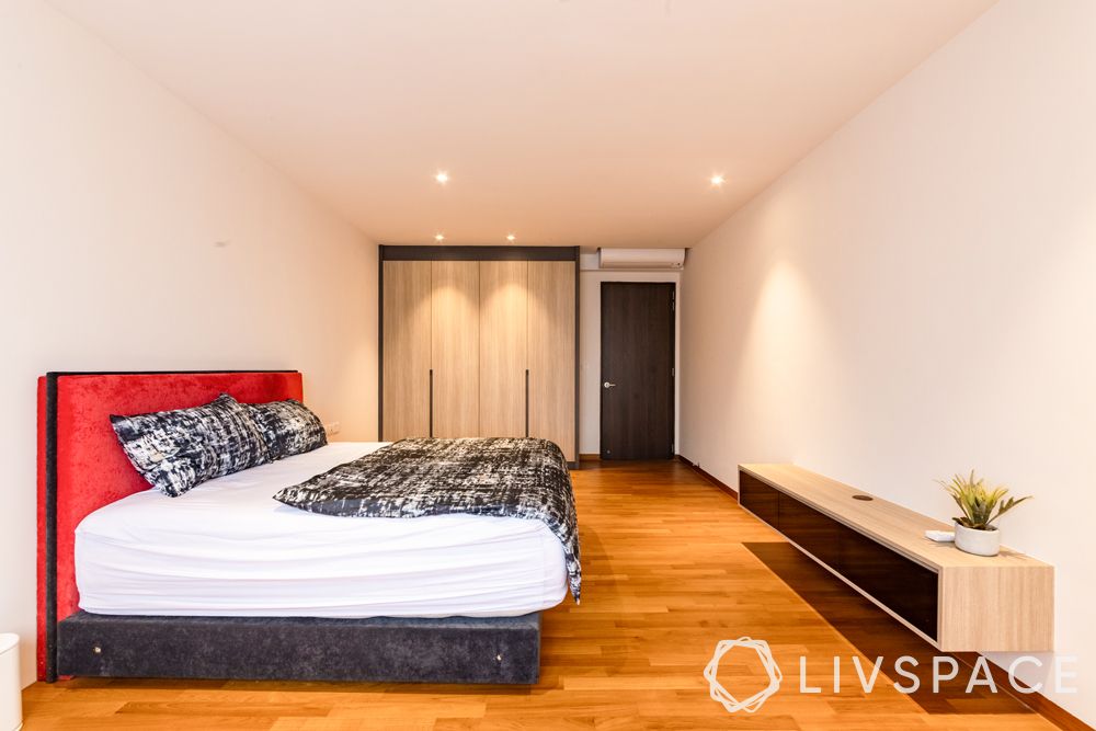 landed-house-design-bedroom-red-headboard-wooden-flooring