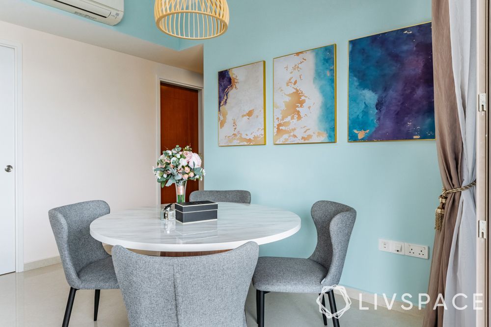 round-dining-tables-blue-wall-grey-chairs