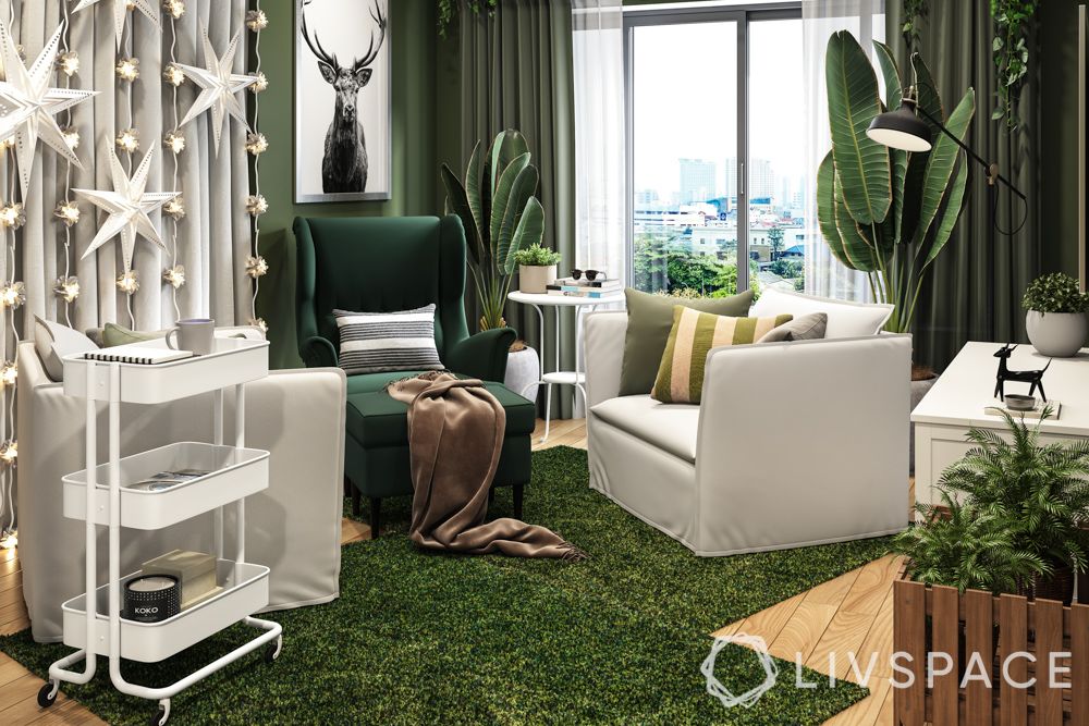 best-interior-design-singapore-living-room-green-wing-chair-rug-white-arm-chair-string-lights