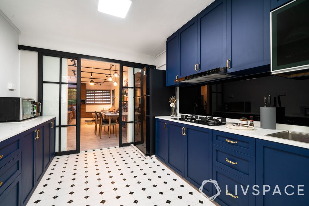 modern-house-blue-kitchen-black-and-white-tile-flooring-sliding-glass-door