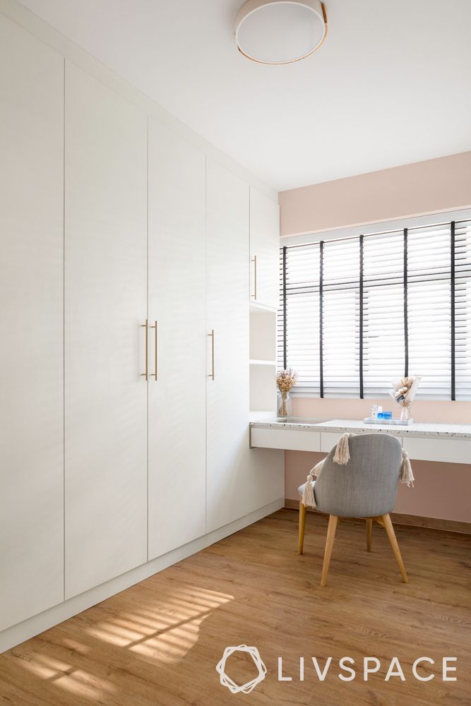 small-house-design-ideas-bedroom-white-wardrobe-vanity-unit-wooden-flooring