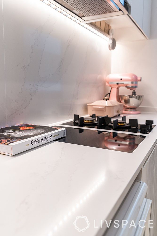 small-condo-interior-design-kitchen-marble-like-countertop-warm-under-cabinet-lights
