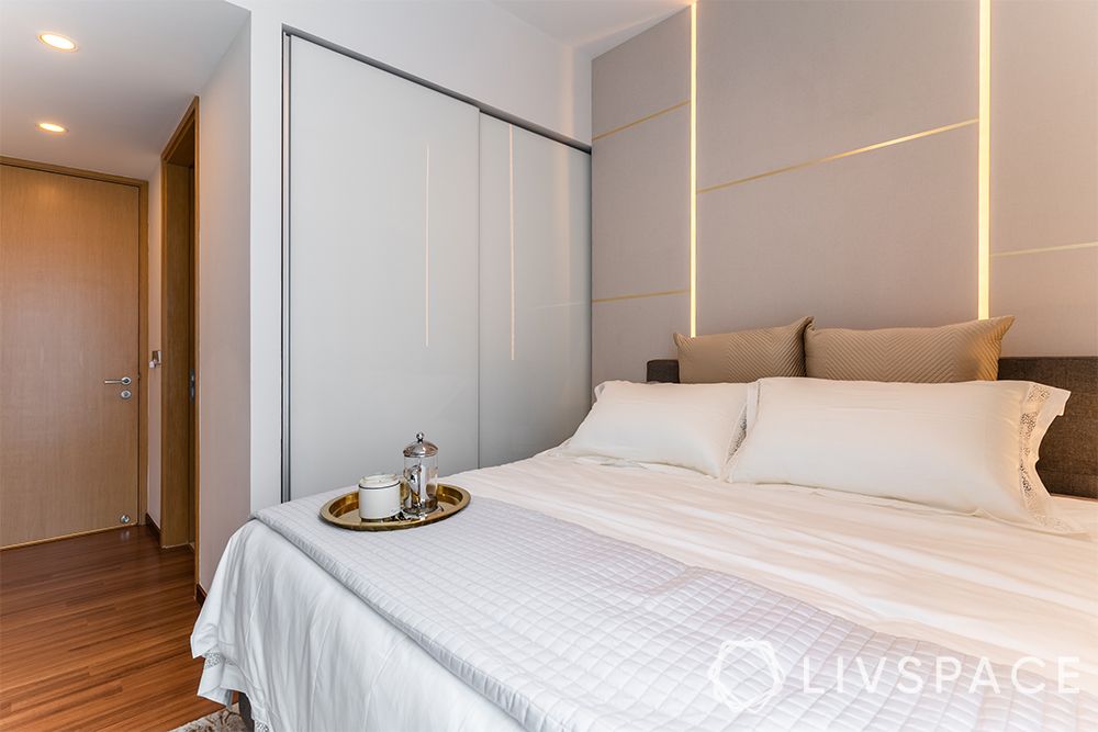 small-condo-interior-design-master-bedroom-wooden-wardrobe-white-sliding-wardrobe