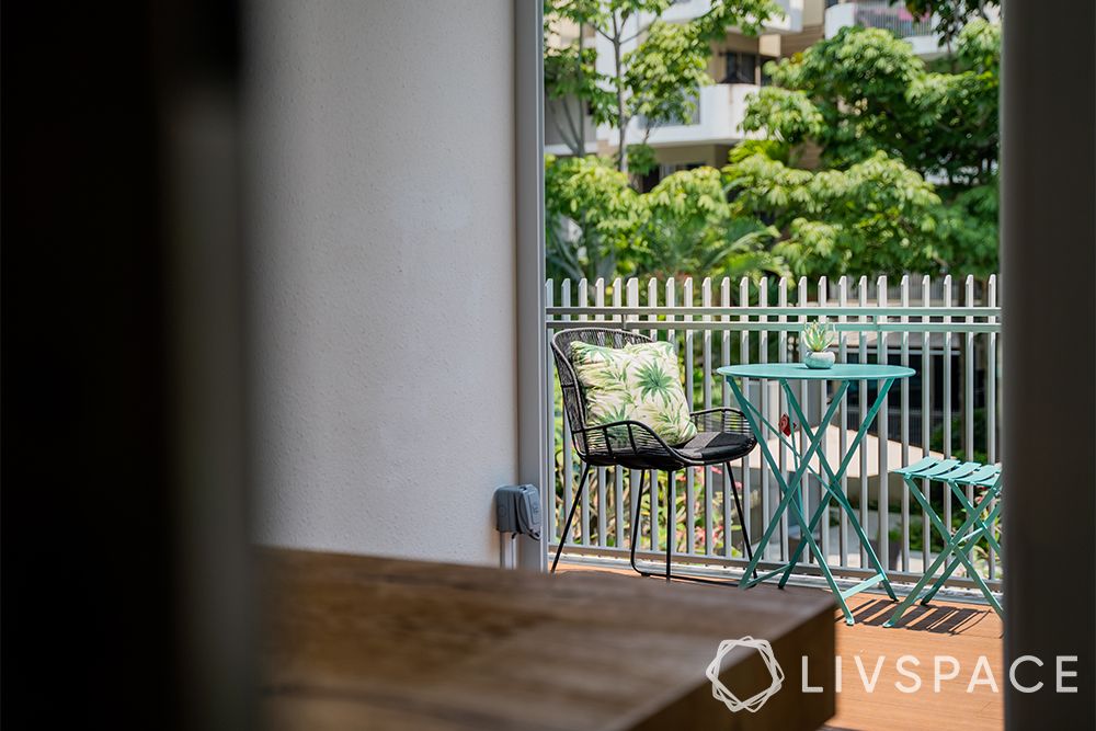 small-condo-interior-design-balcony-chair-blue-table