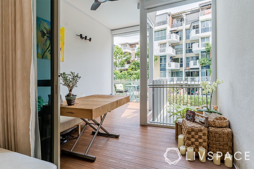 small-condo-interior-design-balcony-wooden-flooring-table-seats