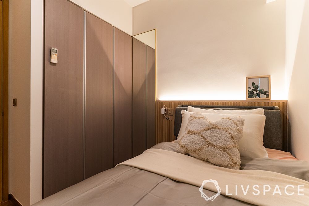 small-condo-interior-design-common-bedroom-brown-fitted-wardrobe-white-walls