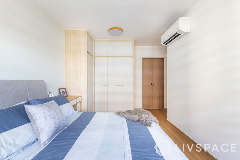 4-room-hdb-renovation-master-bedroom-l-shaped-wardrobe-white-wooden-flooring