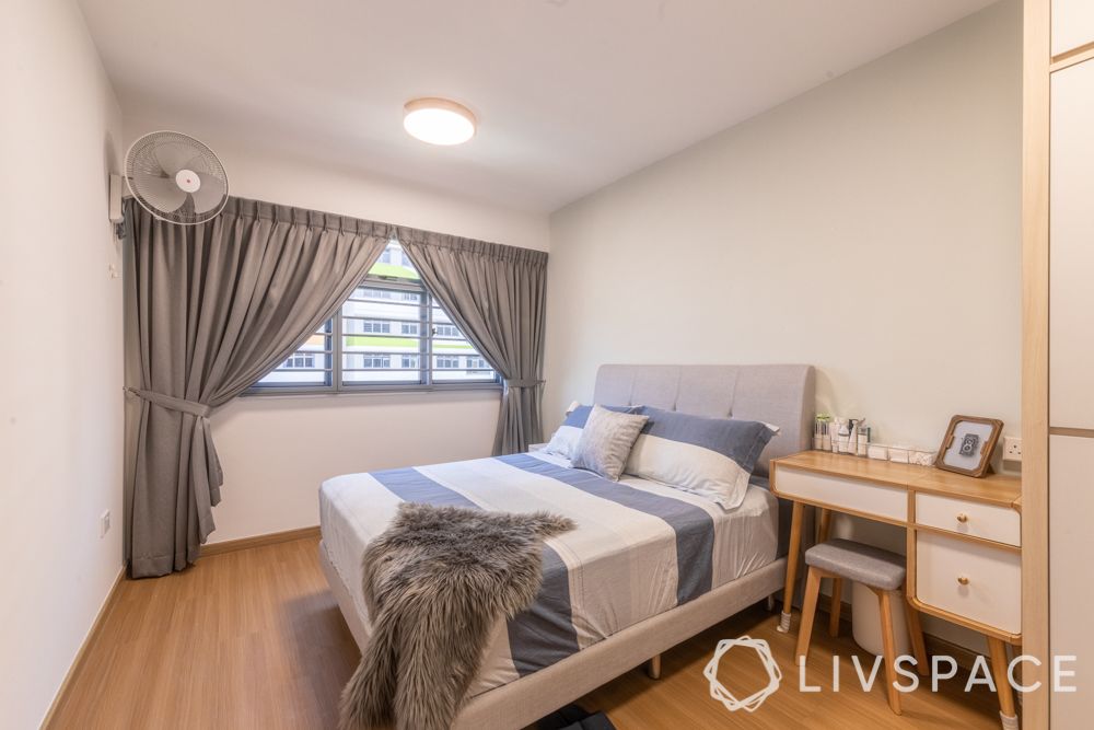 4-room-hdb-renovation-master-bedroom-wooden-flooring-white-walls-grey-curtains